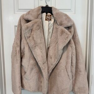 INS faux fur coat in good condition. One button missing.